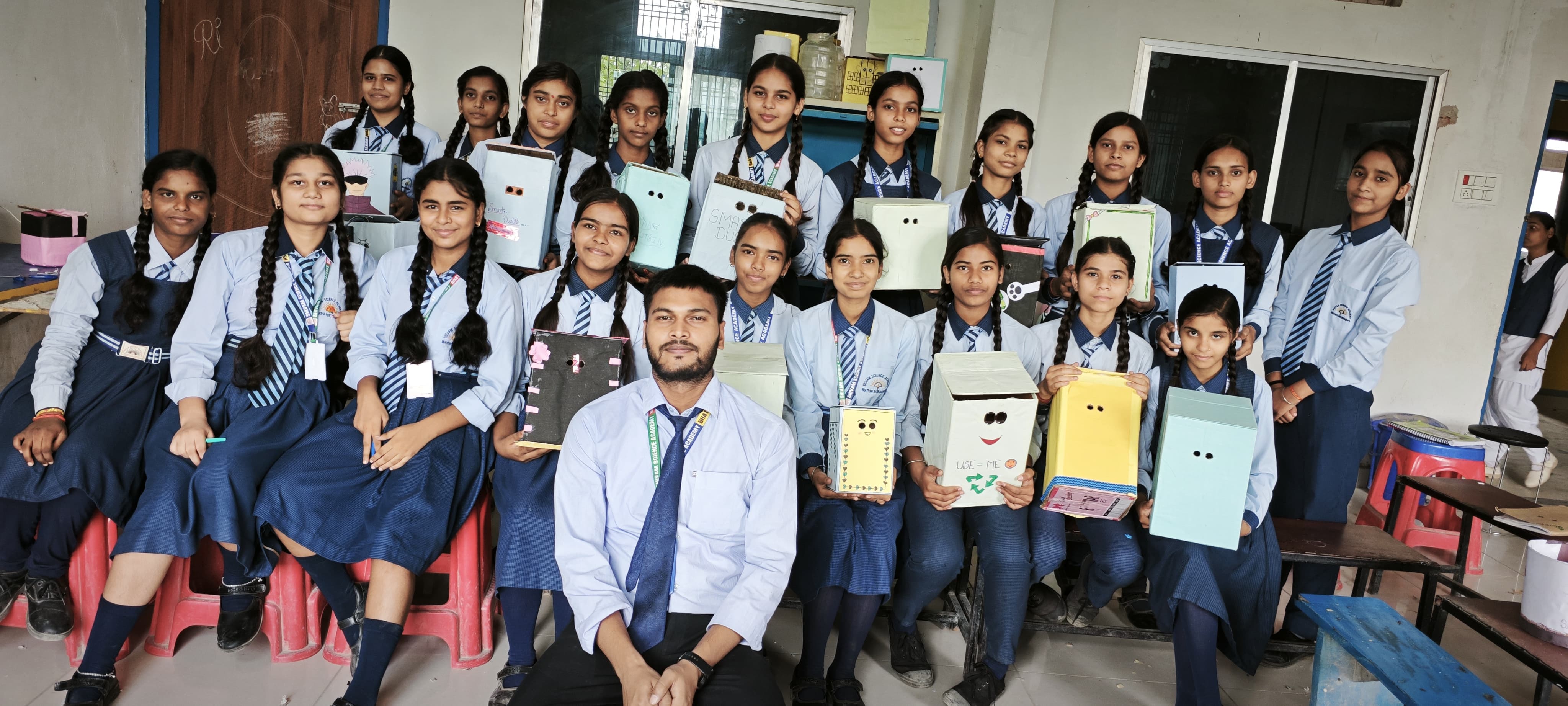 The Smart Dustbin is an AI-based project by Class 9 students that uses sensors for touchless operation and promotes cleanliness.